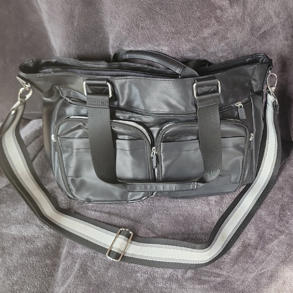 Metallic black IHKWIP cargo catchall tote with guitar strap
